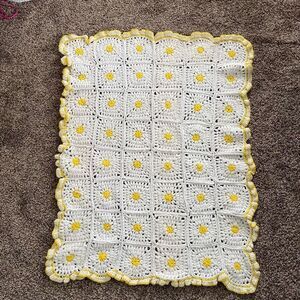 Beautiful white and yellow granny square blanket with ruffle scalloped edges